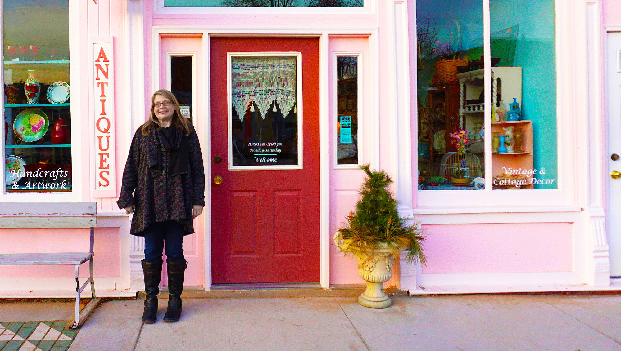 Happy Small Business Owner in front of her business