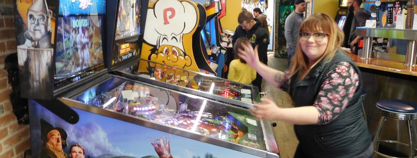 Jessica Bertling loses her ball playing Wizard of Oz pinball machine in Iowa City, IA.